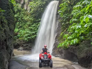 https://soltropical.com/wp-content/uploads/2025/10/ATV-by-a-waterfall-on-a--300x225.webp